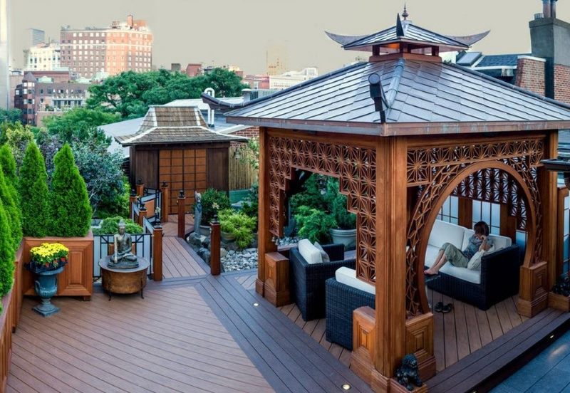 Wooden arbor on the roof of a residential building