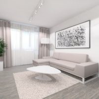 Glezna virs dīvāna modernas paneļu mājas vienistabas dzīvoklī
