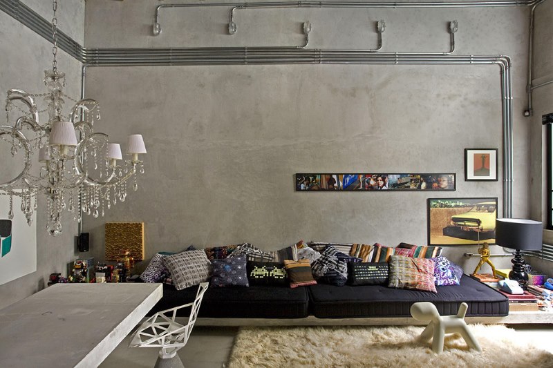 Onvoltooide beton in het ontwerp van een kamer in de stijl van een loft