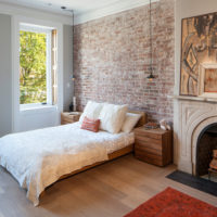 Brick wall decoration over the head of the bed