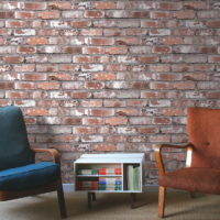 Retro armchairs on brick wall background
