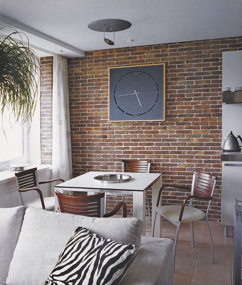 Clock without numbers on the dial in the interior of the kitchen