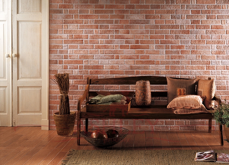 Wooden bench on a background of wallpaper under a red brick