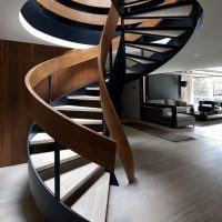 Spiral staircase in the twilight of the hallway