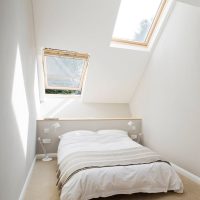 The interior of the white bedroom in the attic