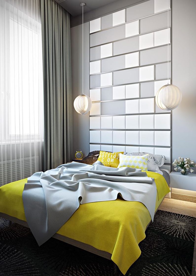 Šedá ložnice se žlutým přehozem na postel