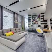 Design of an elongated living room in gray colors