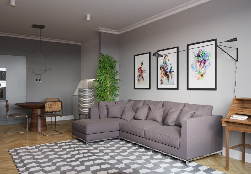 Lukisan-lukisan modular di atas sofa kelabu